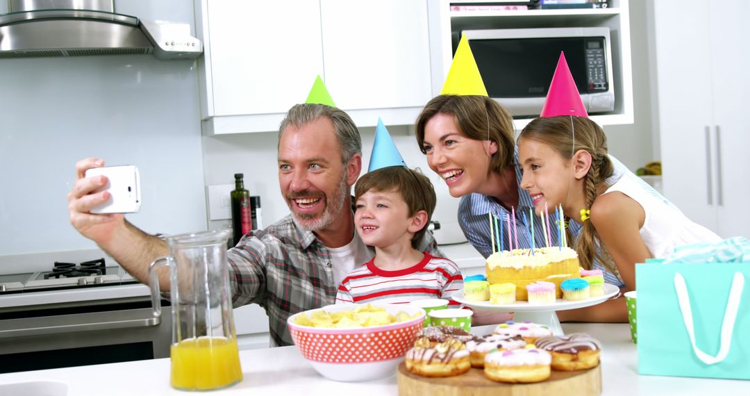 Family Celebrating Birthday Taking Selfie In Kitchen - Free Images, Stock Photos and Pictures on Pikwizard.com