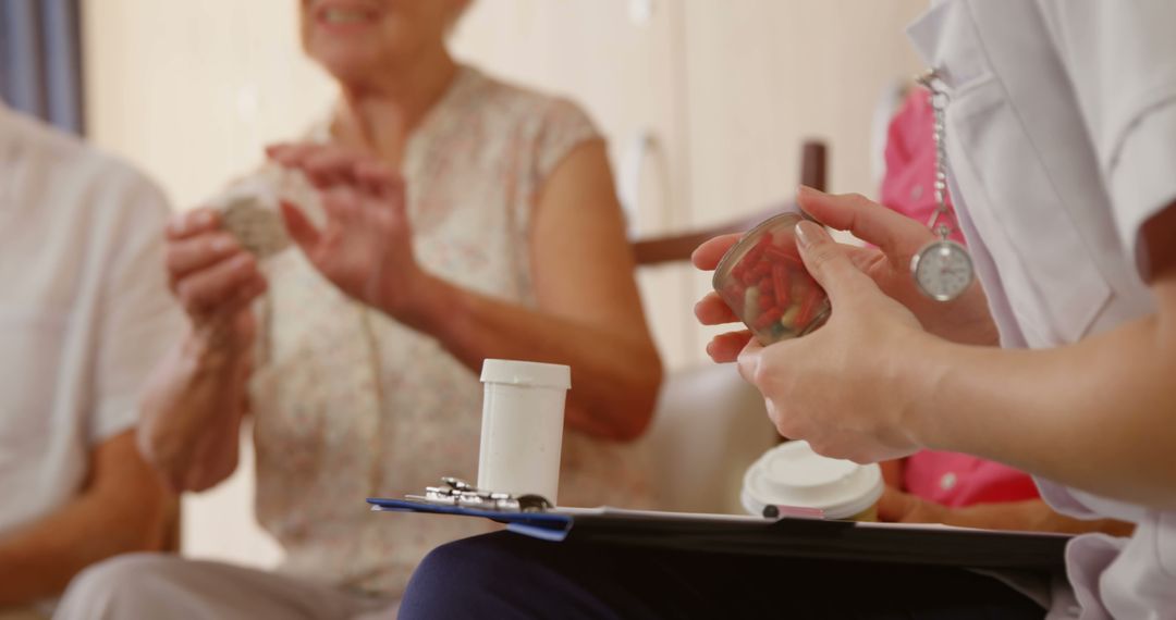 Caregiver and Elderly Woman Discussing Medication at Nursing Home - Free Images, Stock Photos and Pictures on Pikwizard.com