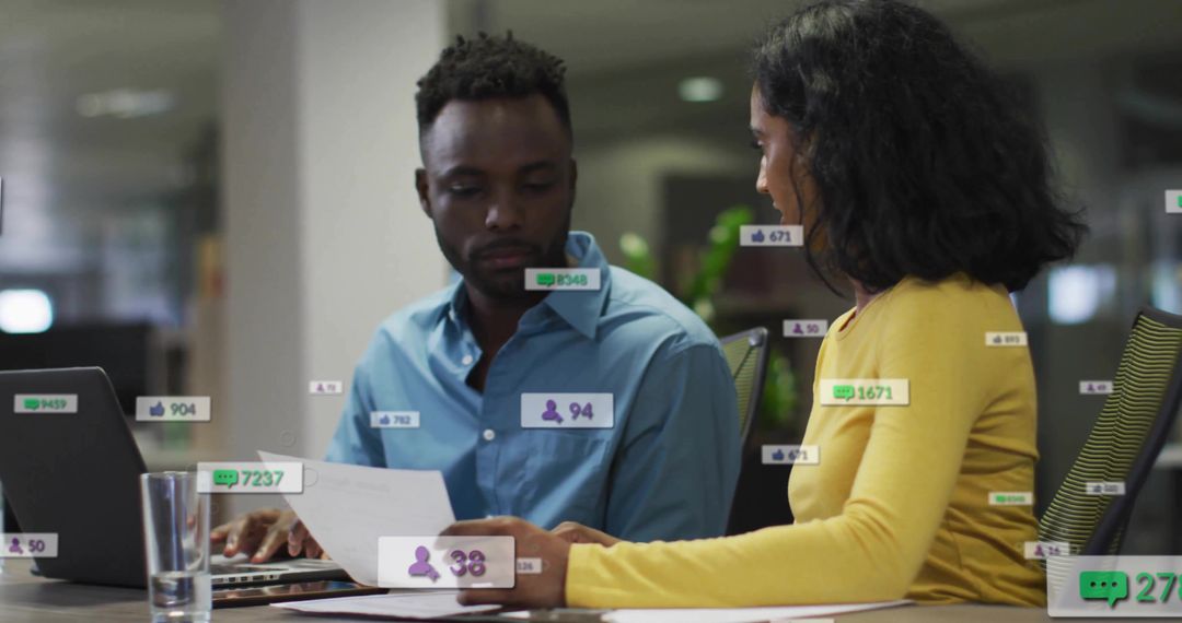Coworkers Analyzing Reports with Engaging Data Overlay in Modern Office