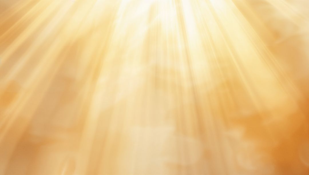 Golden Sunbeams Streaming Through Hazy Sky with Soft Bokeh Glow and Rays