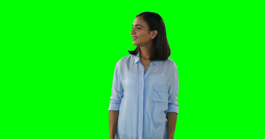 Smiling Woman in Casual Outfit Posing with Green Screen Background - Free Images, Stock Photos and Pictures on Pikwizard.com