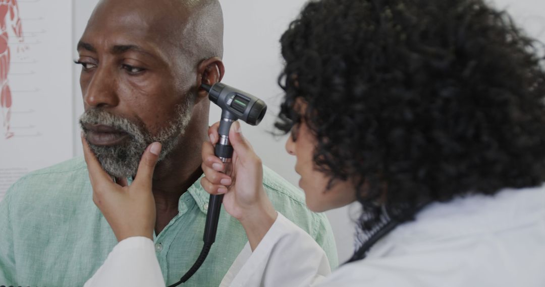 Doctor Examining Elderly Patient's Ear with Otoscope - Free Images, Stock Photos and Pictures on Pikwizard.com