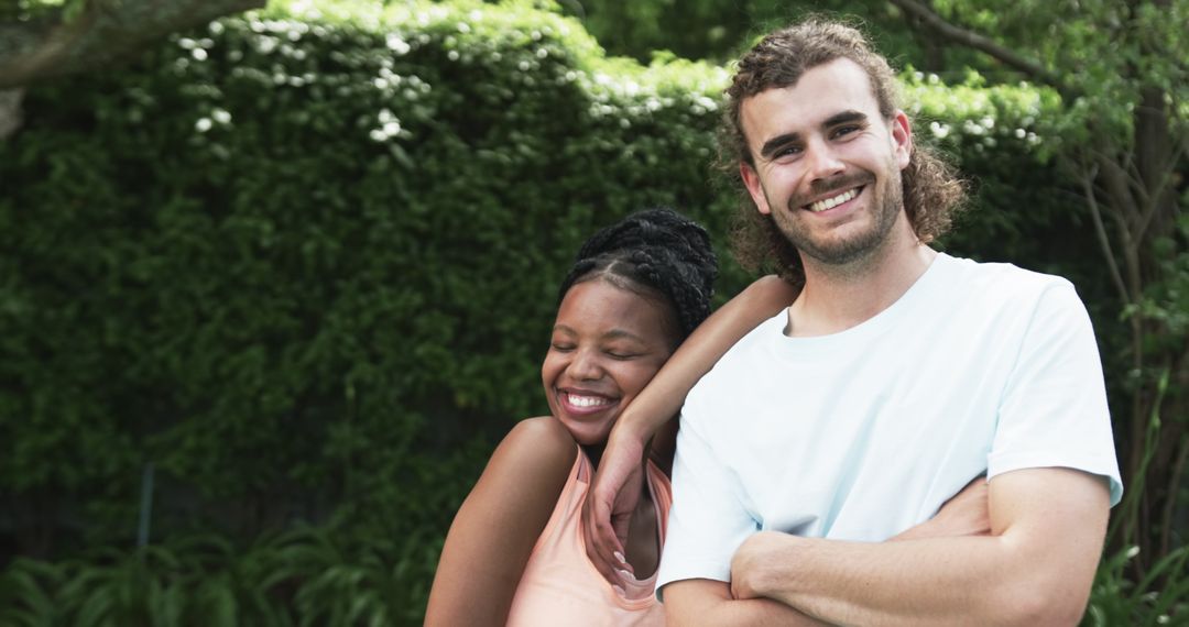 Diverse Couple Smiling in Outdoor Setting