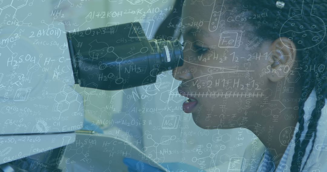 Young Scientist Enthralled with Research Through Microscope