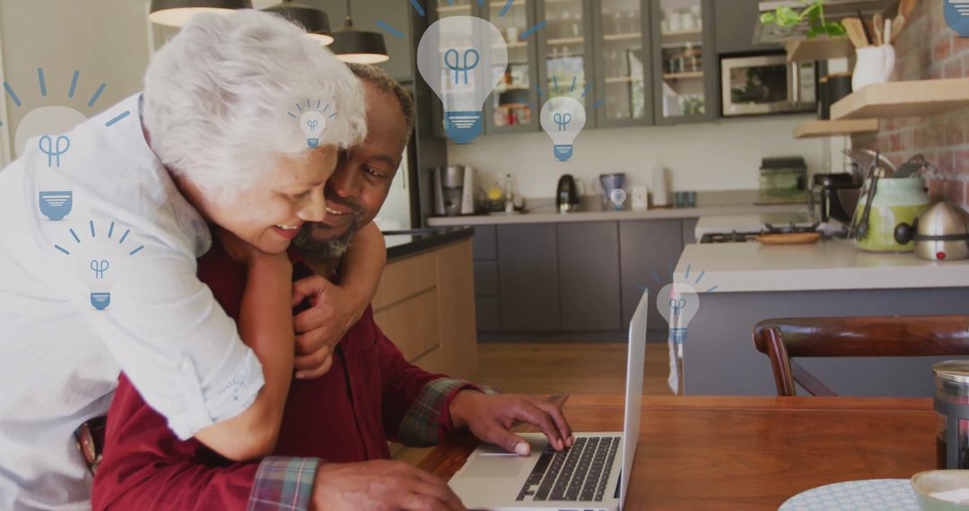 Senior Couple Embracing with Light Bulb Graphics in Modern Kitchen
