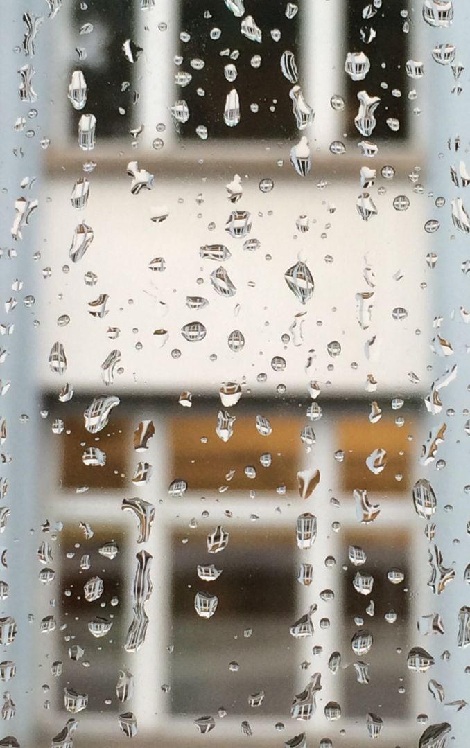 Close-up of raindrops on window with blurred building in background - Free Images, Stock Photos and Pictures on Pikwizard.com