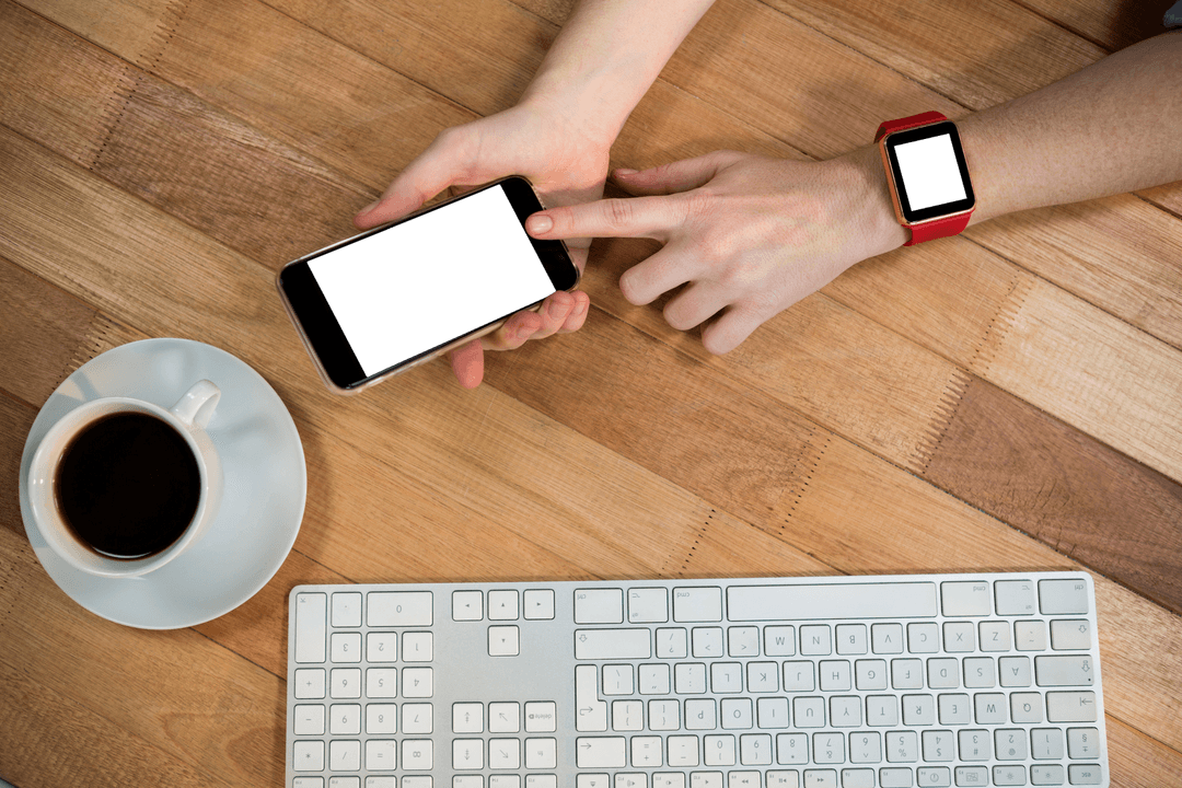 Transparent View Businesswoman Using Smartphone with Smartwatch and Keyboard