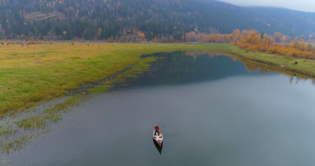 Aerial View of Kayak on Serene Lake in Autumn Landscape - Free Images, Stock Photos and Pictures on Pikwizard.com