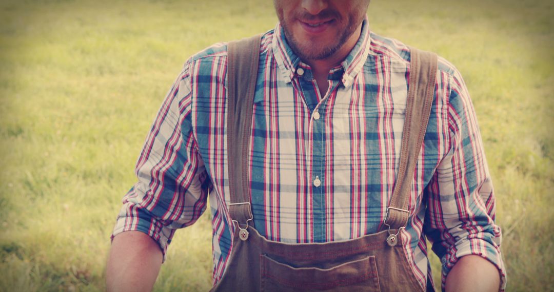 Farmer Wearing Checkered Shirt and Overalls at Farm - Free Images, Stock Photos and Pictures on Pikwizard.com