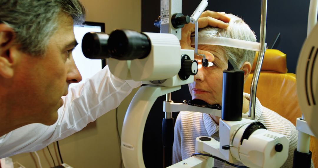 Optometrist Examining Senior Woman's Eyes with Slit Lamp - Free Images, Stock Photos and Pictures on Pikwizard.com