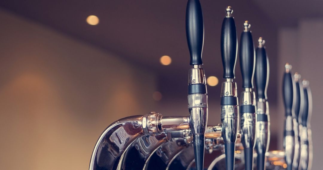 Close-up View of Beer Taps in Modern Bar