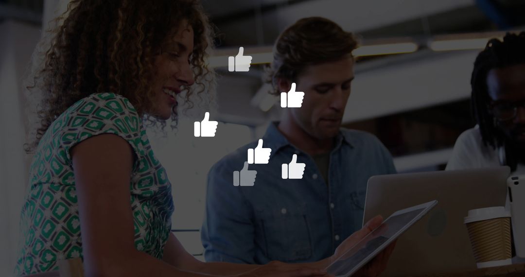 Colleagues Reviewing Tablet in Modern Office with Like Icons