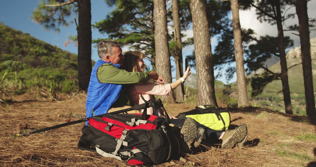 Senior Couple Taking Selfie in Forest During Hike - Free Images, Stock Photos and Pictures on Pikwizard.com