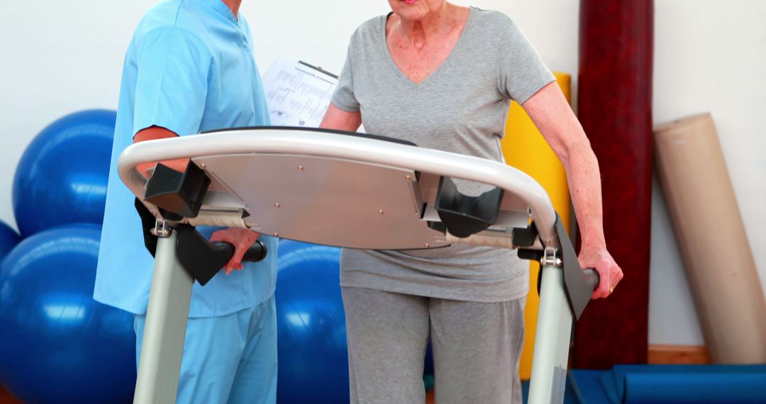 Senior Woman Exercising on Treadmill with Physical Therapist Assistance - Free Images, Stock Photos and Pictures on Pikwizard.com