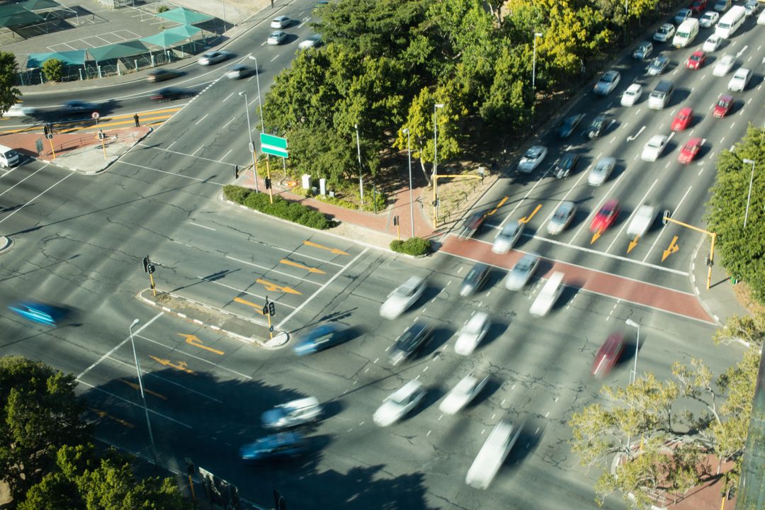 High Angle View of Busy City Intersection with Moving Cars - Free Images, Stock Photos and Pictures on Pikwizard.com