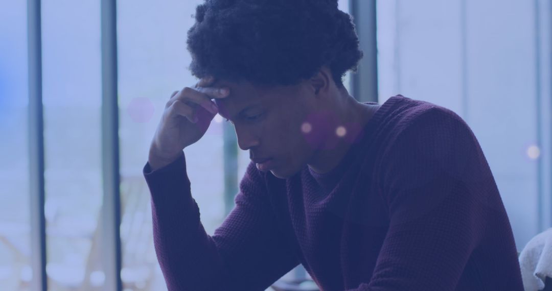 Pensive Man Experiencing Thoughts in Meditative Environment