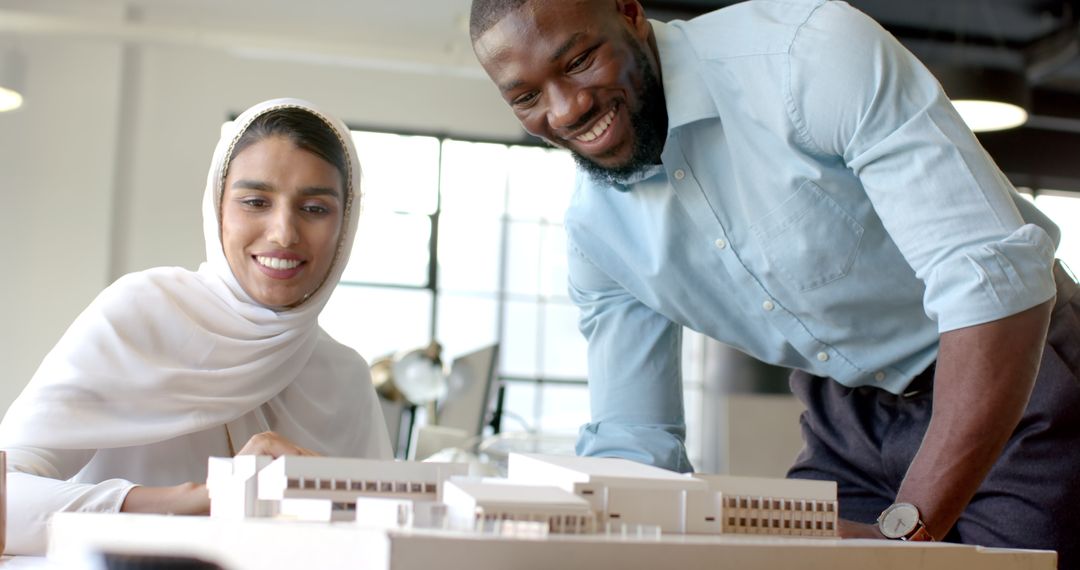 Diverse Colleagues Collaborating on Architecture Model