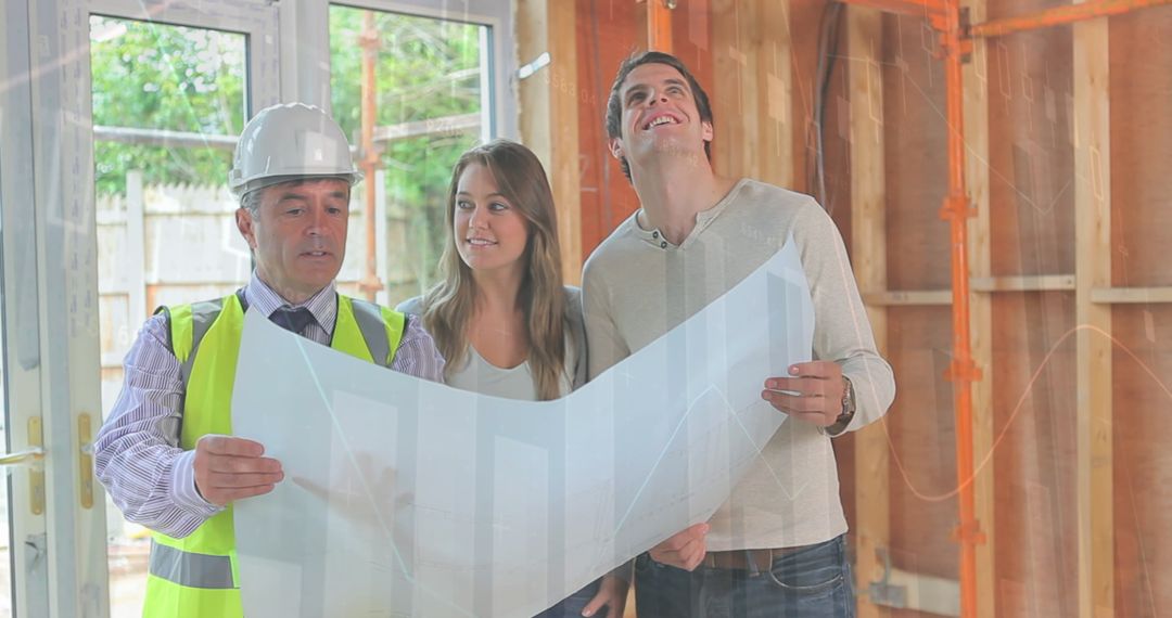 Engineer and Couple Reviewing Building Plans at Construction Site