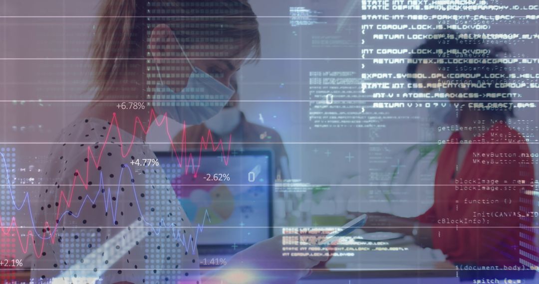 Colleagues Using Digital Interface Wearing Masks in Office