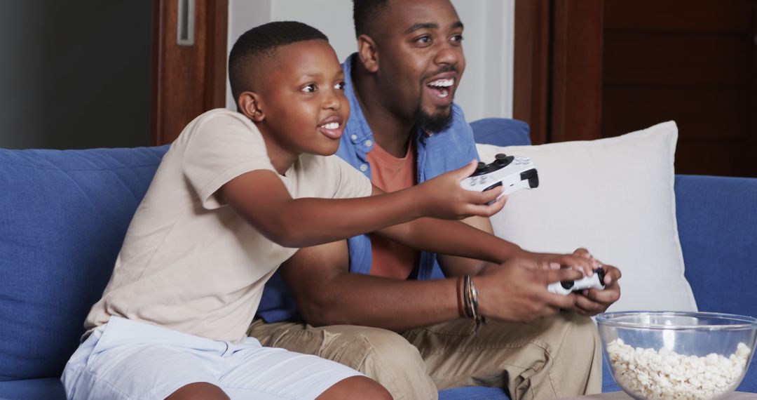 Father and Son Bonding While Playing Video Games at Home