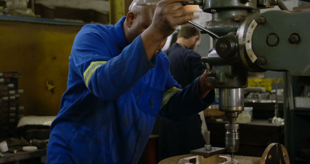 Engineer Operating Heavy Machine in Industrial Workshop - Free Images, Stock Photos and Pictures on Pikwizard.com