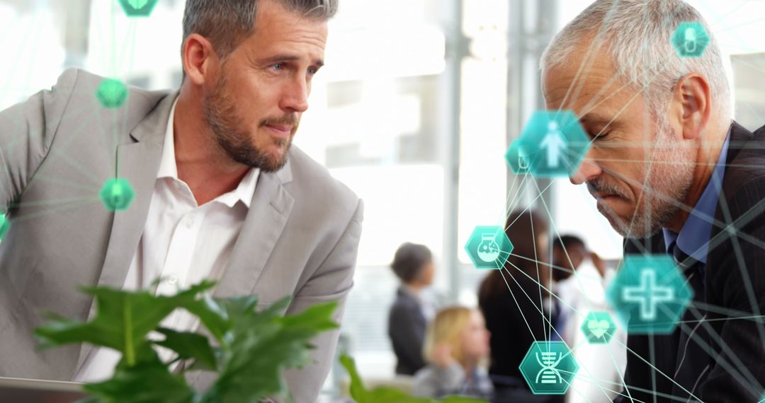 Businessmen Collaborating Amidst Network Technology Icons in Modern Office