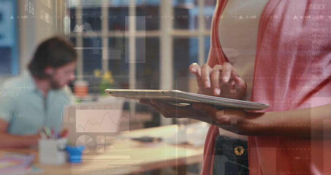 Diverse Colleagues Collaborating on Digital Tablet in Modern Office
