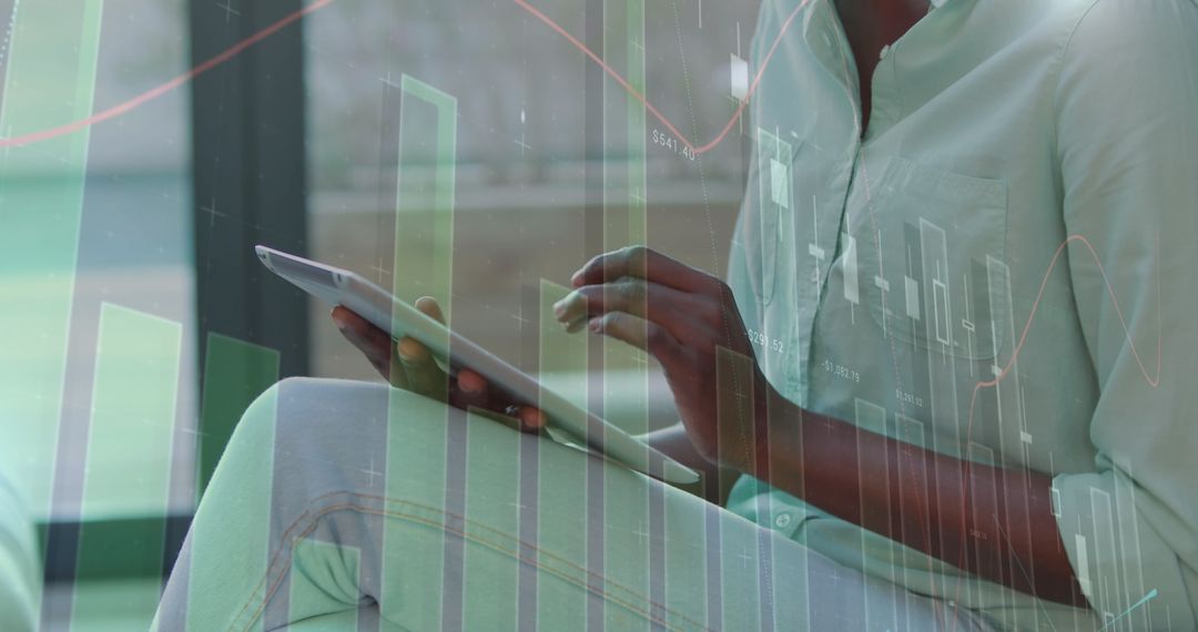 African American Woman using Tablet with Digital Data Overlay in Office
