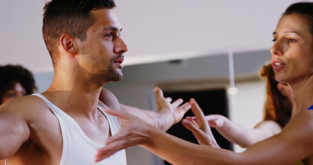 Ballet Instructor Guiding Male Dancer in Studio - Free Images, Stock Photos and Pictures on Pikwizard.com