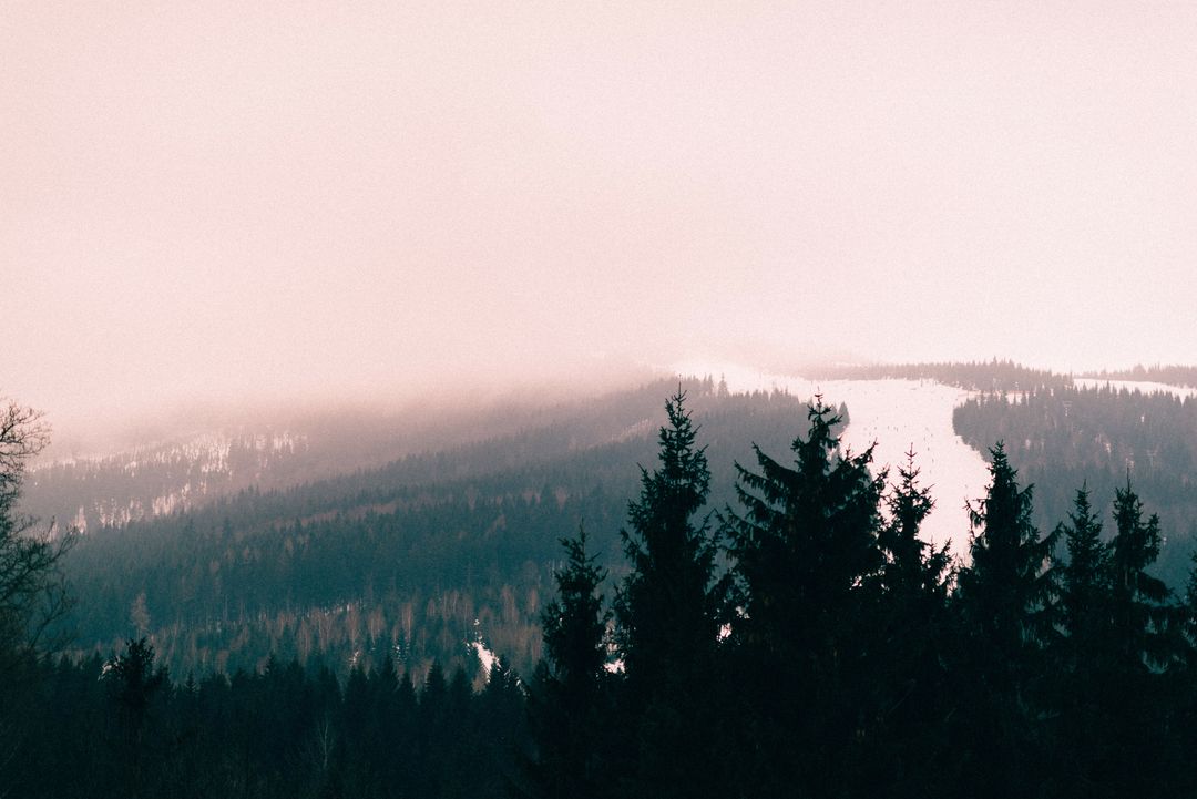 Mist-Covered Mountain Range in Winter Twilight