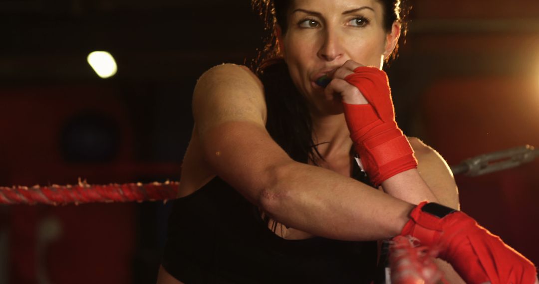 Woman Boxer Resting Ringside During Training Session - Free Images, Stock Photos and Pictures on Pikwizard.com