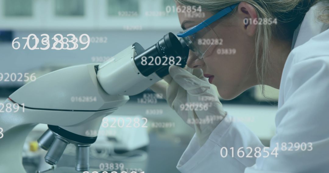 Female Scientist Investigating Microscope Data in Laboratory