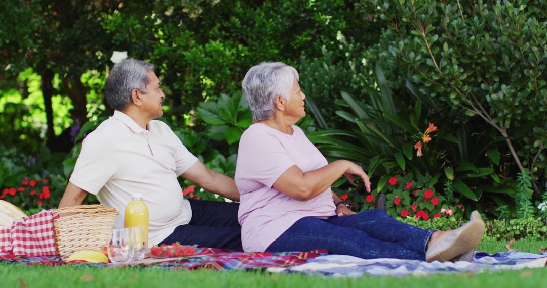 Image of happy biracial senior couple having picnic in garden - Free Images, Stock Photos and Pictures on Pikwizard.com