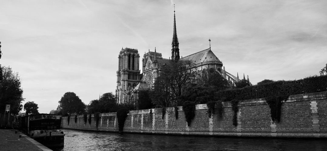 Black and White View of Notre Dame Cathedral from River Seine - Free Images, Stock Photos and Pictures on Pikwizard.com