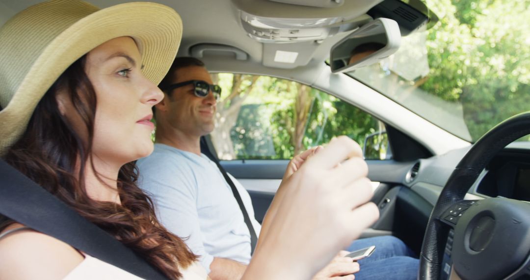 Couple Enjoying Relaxed Drive on Sunny Day