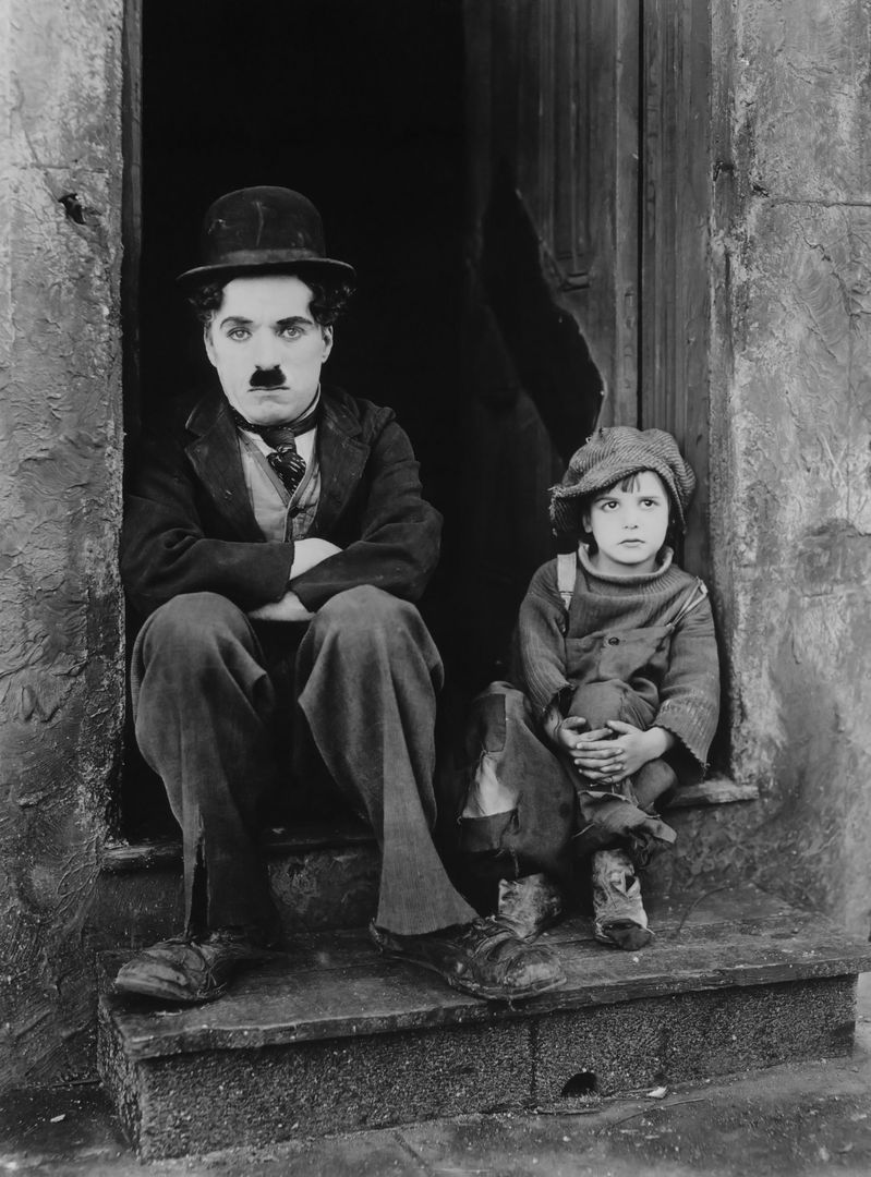 Classic Scene of Man with Mustache and Boy Sitting on Steps - Free Images, Stock Photos and Pictures on Pikwizard.com