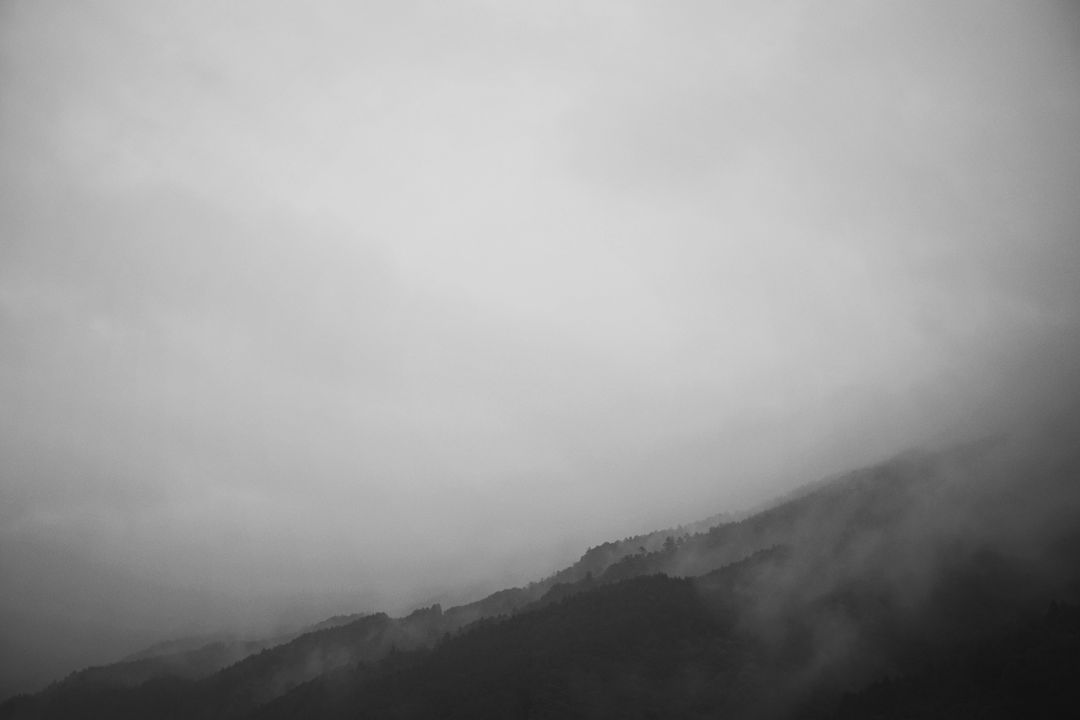 Misty Mountain Range in Grey Fog - Free Images, Stock Photos and Pictures on Pikwizard.com