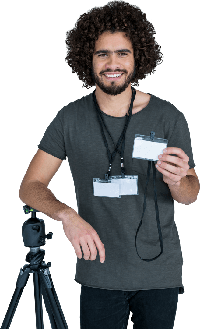 Smiling Male Photographer with Blank Identity Cards Standing by Camera