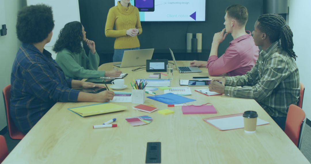 Diverse Team Collaborating on Business App Design Project in Office