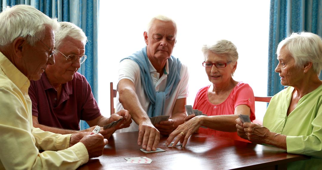 Senior Friends Enjoying Card Game at Retirement Home - Free Images, Stock Photos and Pictures on Pikwizard.com