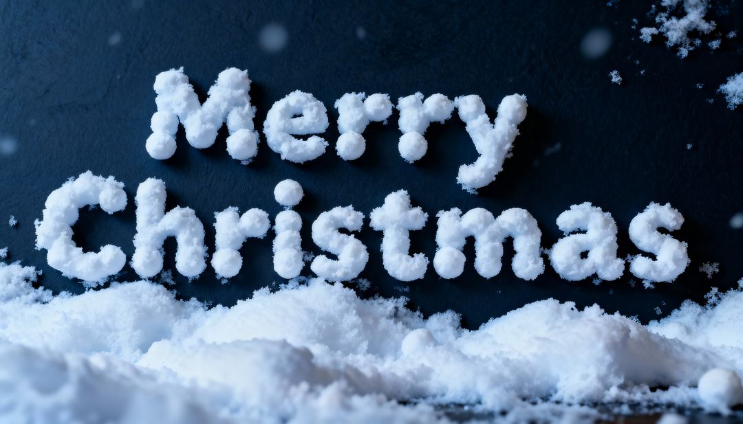 Merry Christmas forming from snow letters on dark slate with snowy foreground