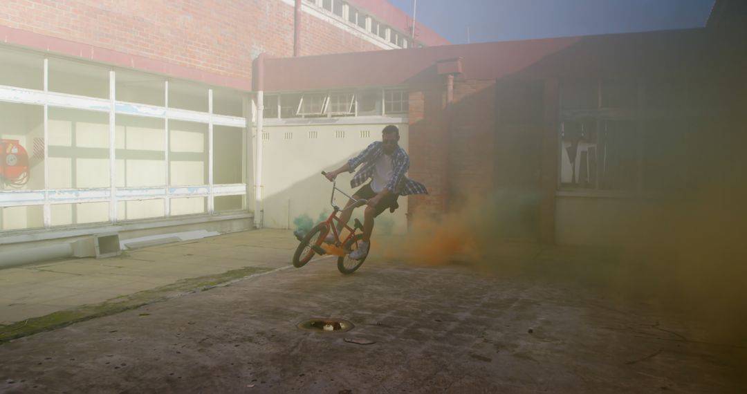 BMX Rider Performing Stunt With Smoke Effects - Free Images, Stock Photos and Pictures on Pikwizard.com