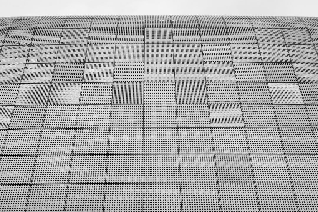 Abstract Metallic Grid Pattern on Modern Building Facade - Free Images, Stock Photos and Pictures on Pikwizard.com