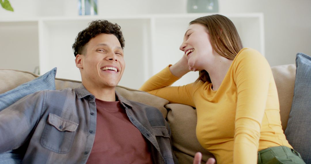 Laughing Couple Enjoying Relaxed Moment at Home