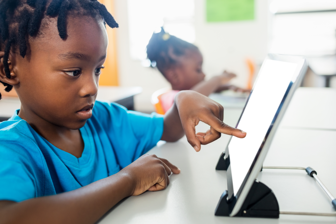 Boy Interacting with Transparent Digital Tablet in Classroom - Download Free Stock Images Pikwizard.com