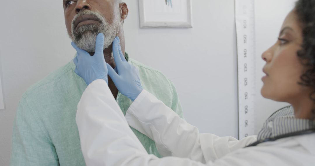 Doctor Examining Senior Man's Neck for Check-up at Clinic - Free Images, Stock Photos and Pictures on Pikwizard.com