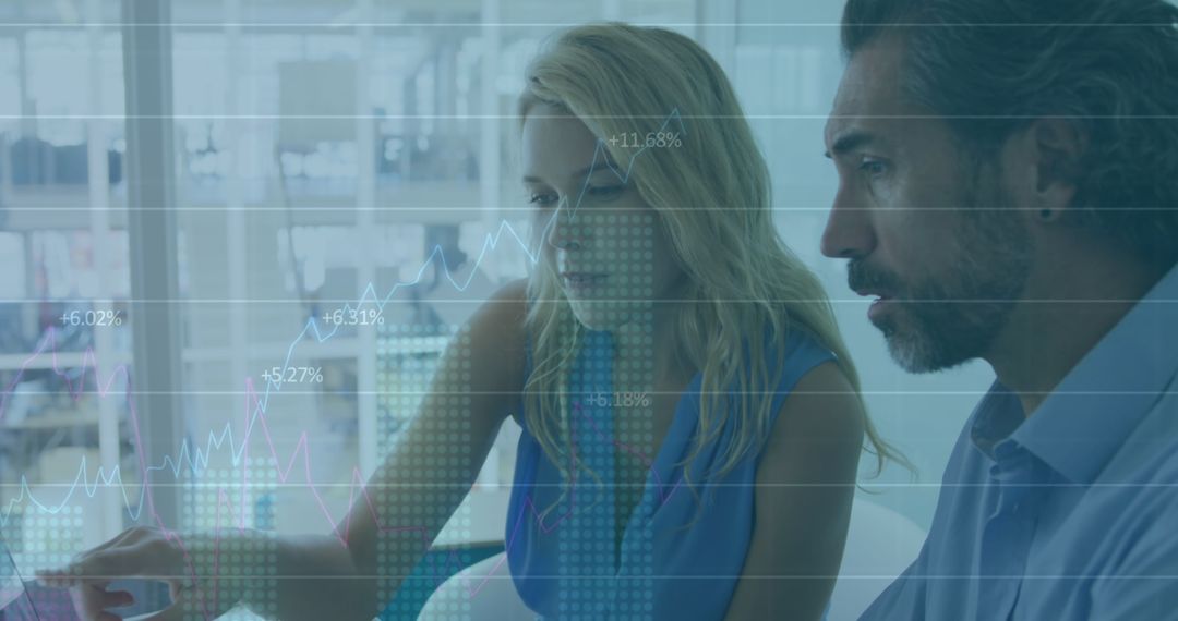 Diverse Professionals Analyzing Data Trends in Digital Environment