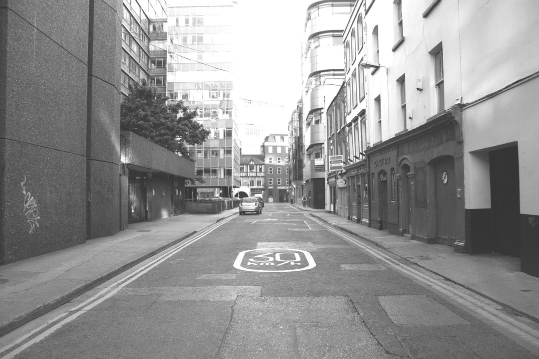 Empty Street in Urban City with Speed Limit Markings - Free Images, Stock Photos and Pictures on Pikwizard.com