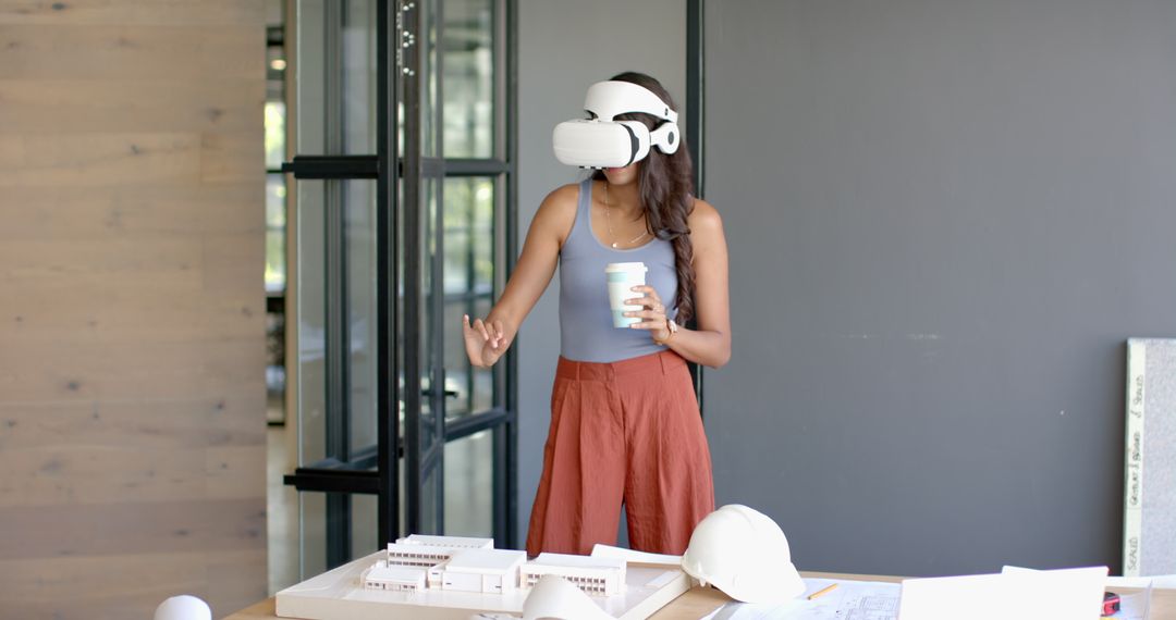 Woman Using VR Headset with Architectural Model in Modern Office