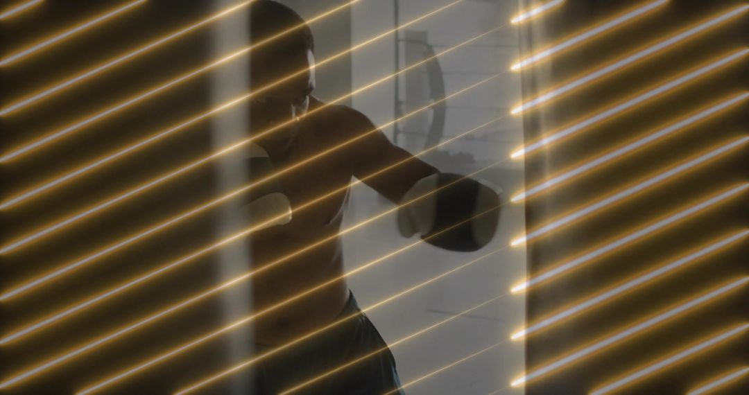 Shirtless Boxer Training Punch Combinations with Intensity